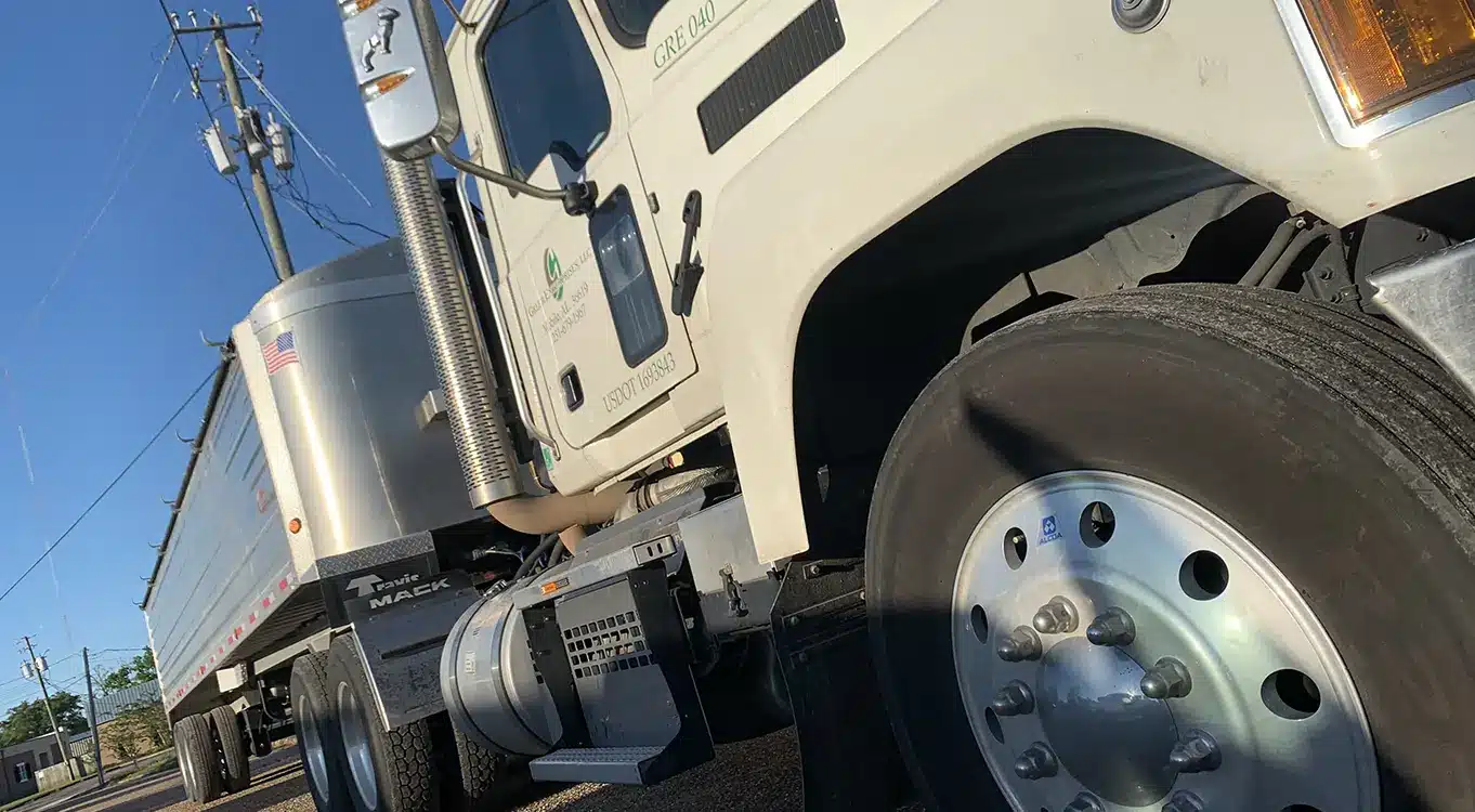 A Greer Enterprises Mack tractor and end dump trailer.