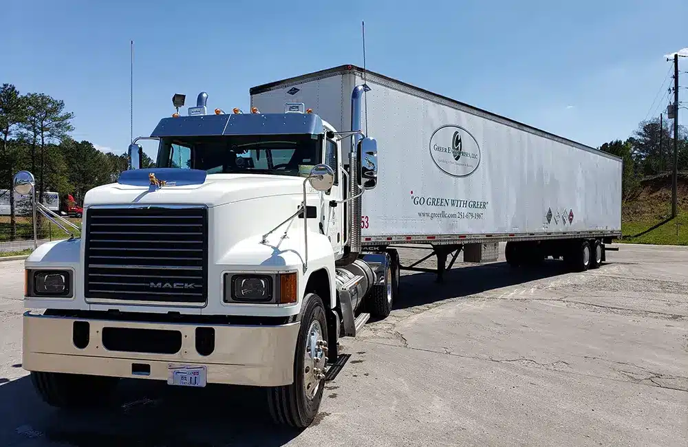 Greer dry van tractor trailer used for waste transportation.