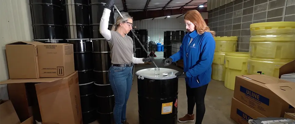 Greer staff sampling a drum to confirm the waste profile.